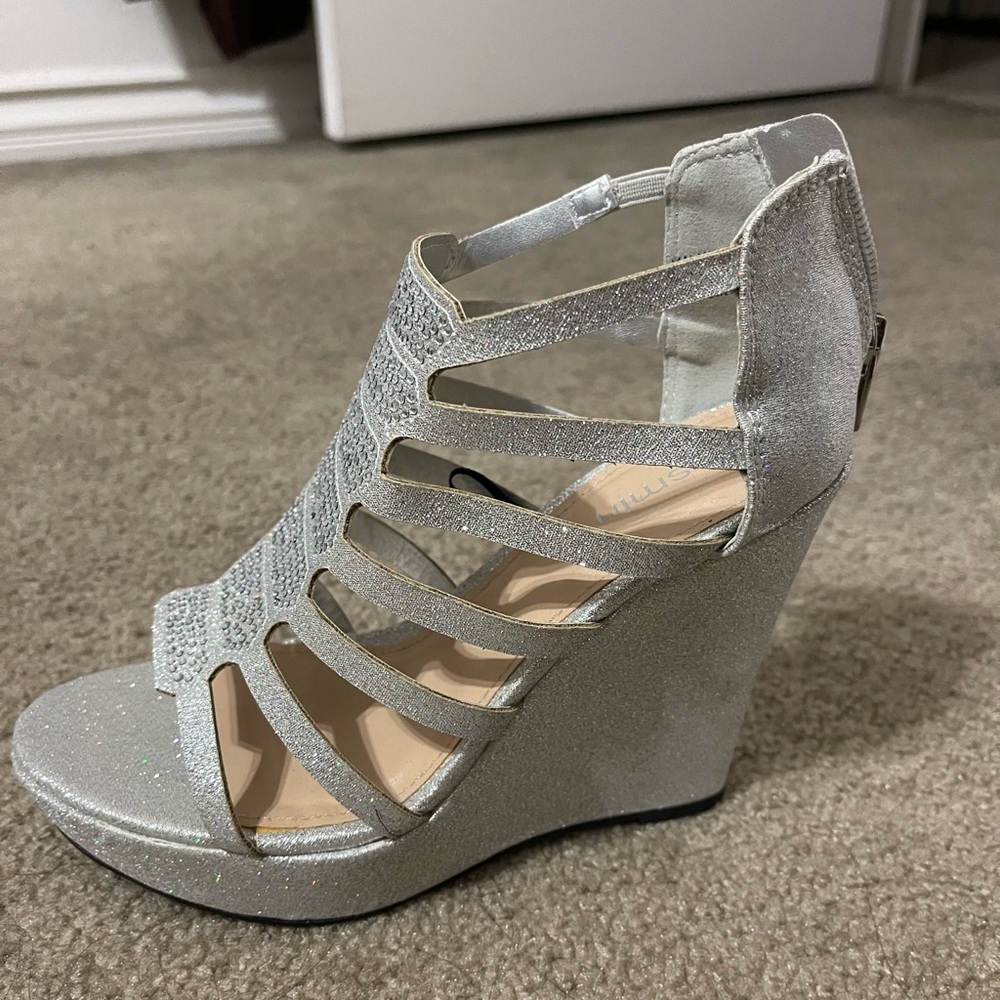 Silver wedge heels. Heel height 4 inches. Never used